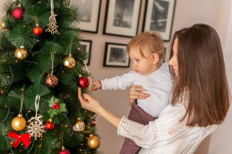 Mother and son decorating Christmas tree